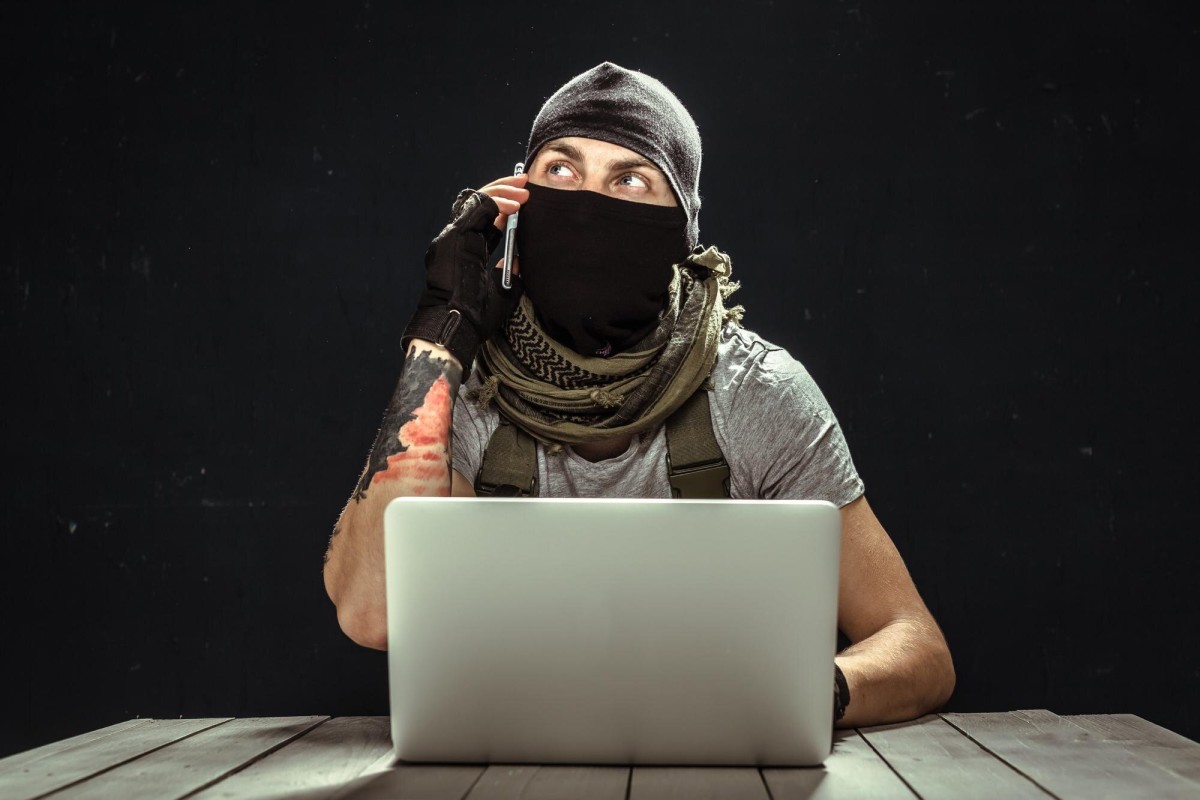 Thief stealing documents from a filing cabinet