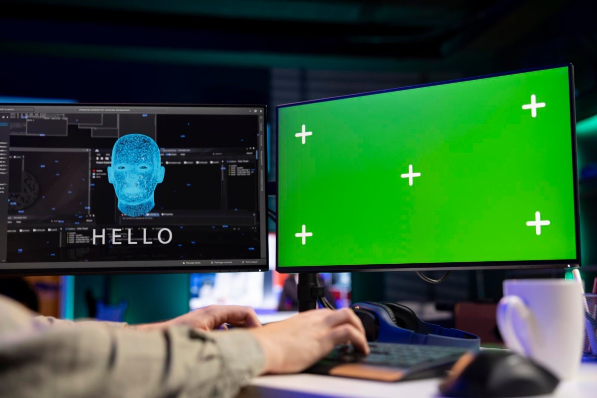 Person watching tech tutorial on laptop screen