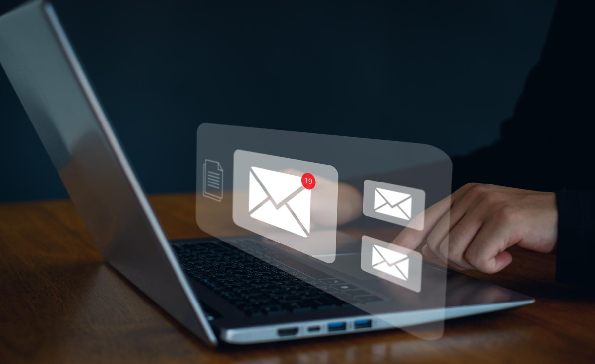 Person reading email newsletter on laptop