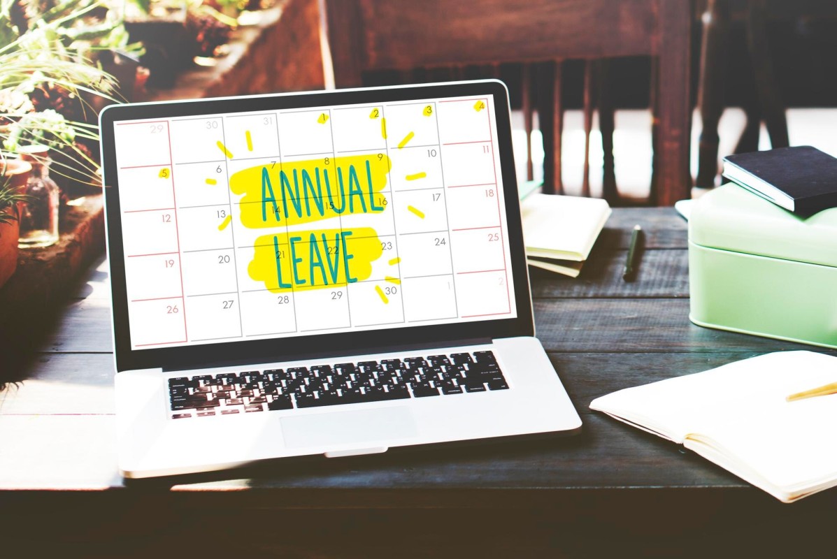 Person marking dates on a calendar