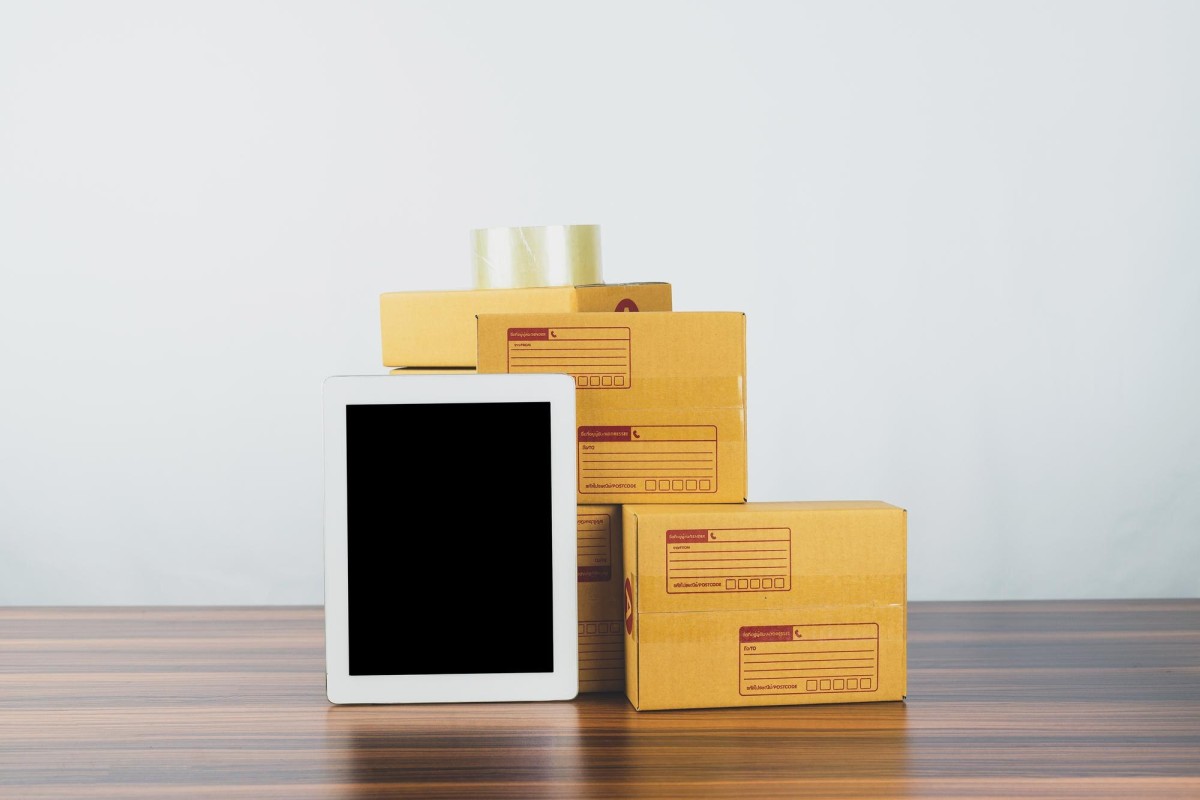 Person packaging products for online store