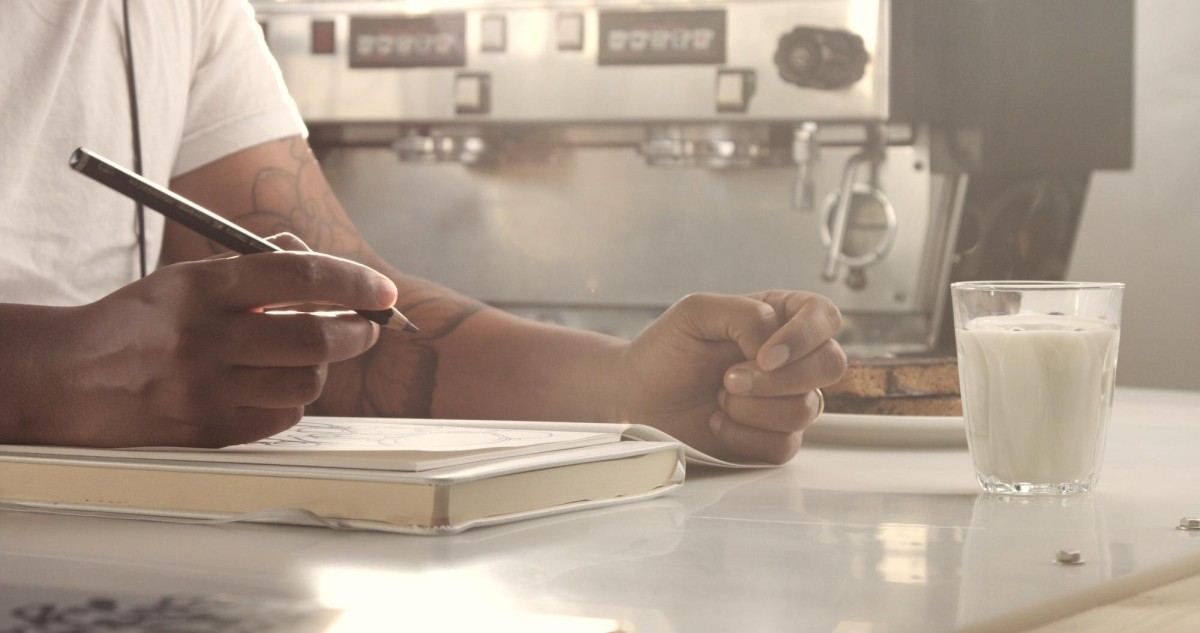 Writer working at desk with laptop
