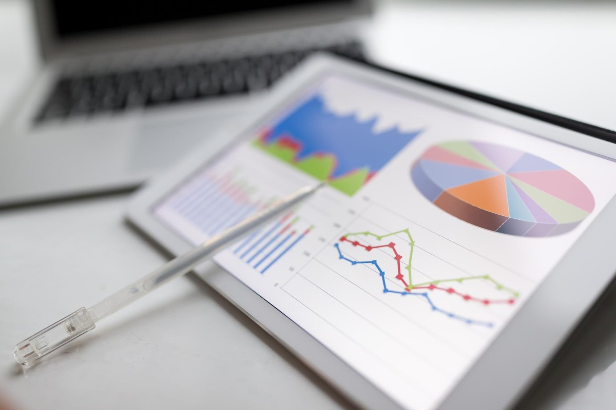 Researcher analyzing charts and statistical data