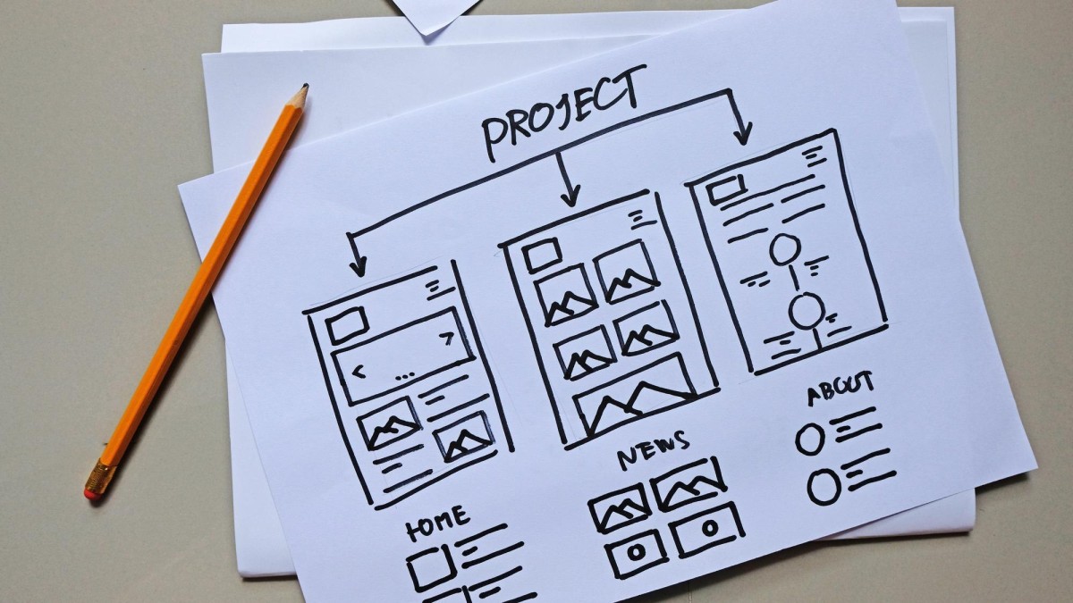 Person laying foundation blocks for structure