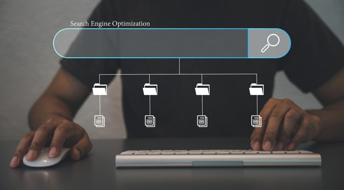 Magnifying glass searching website on computer screen