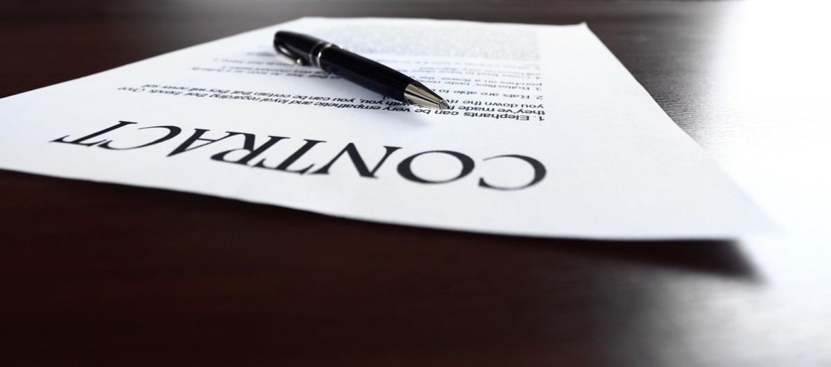 Person using laptop for online posting service