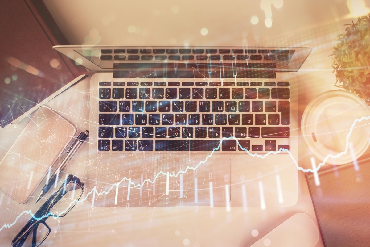 Person researching profitable keywords on laptop