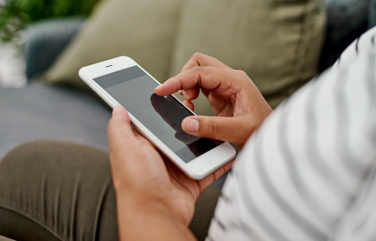 Person using smartphone for mobile browsing