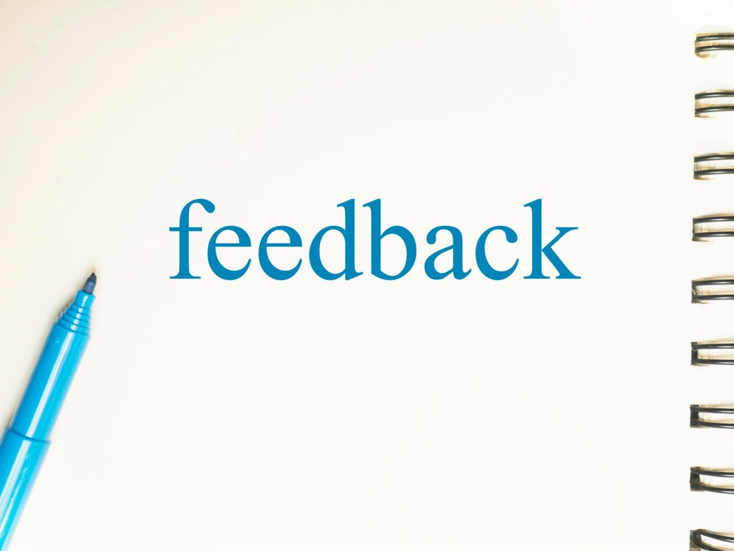 Person writing a positive online testimonial