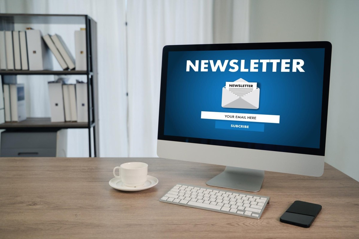 Person sending email newsletter to subscribers