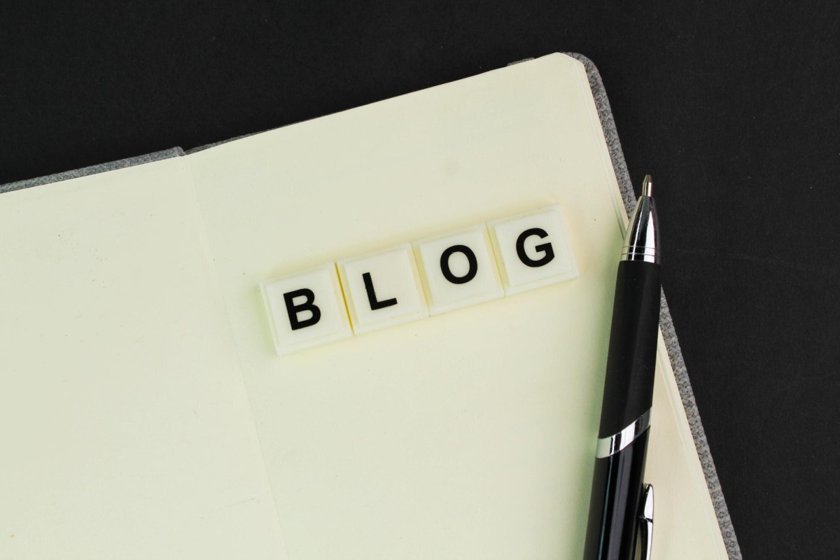 Person writing SEO blog content at desk