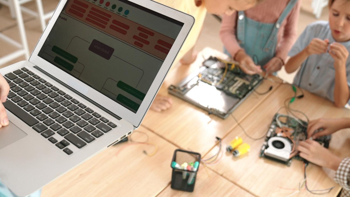 Person building a webpage on laptop