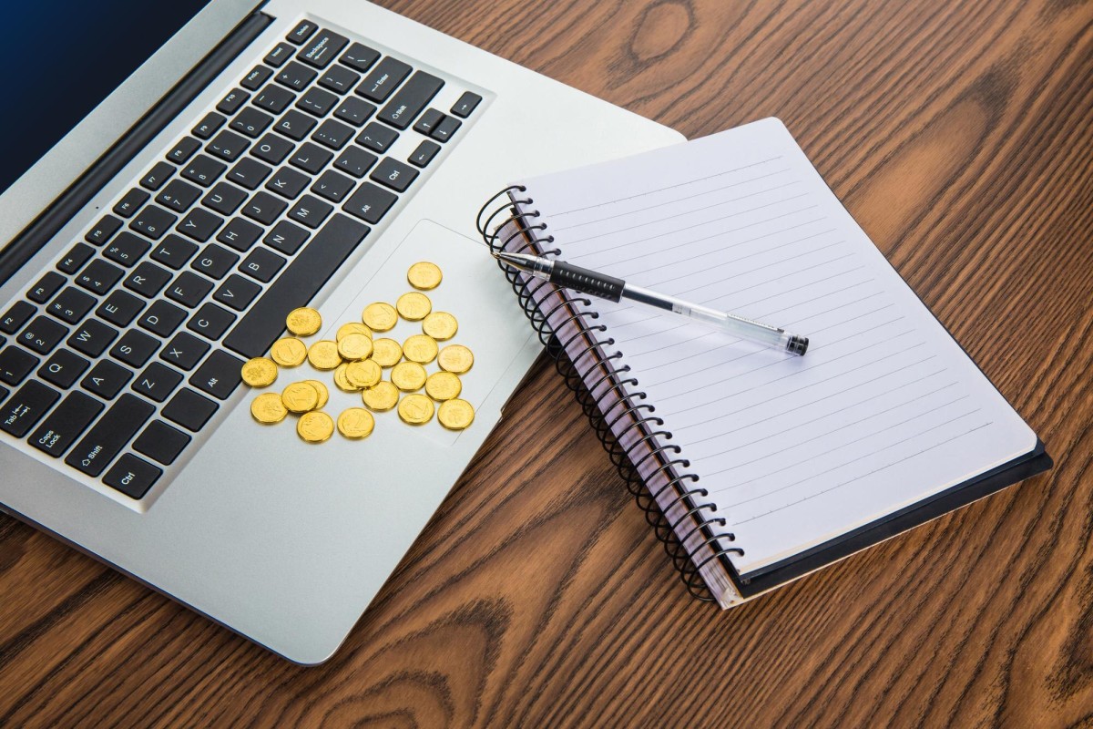 Budget-conscious writer working at desk