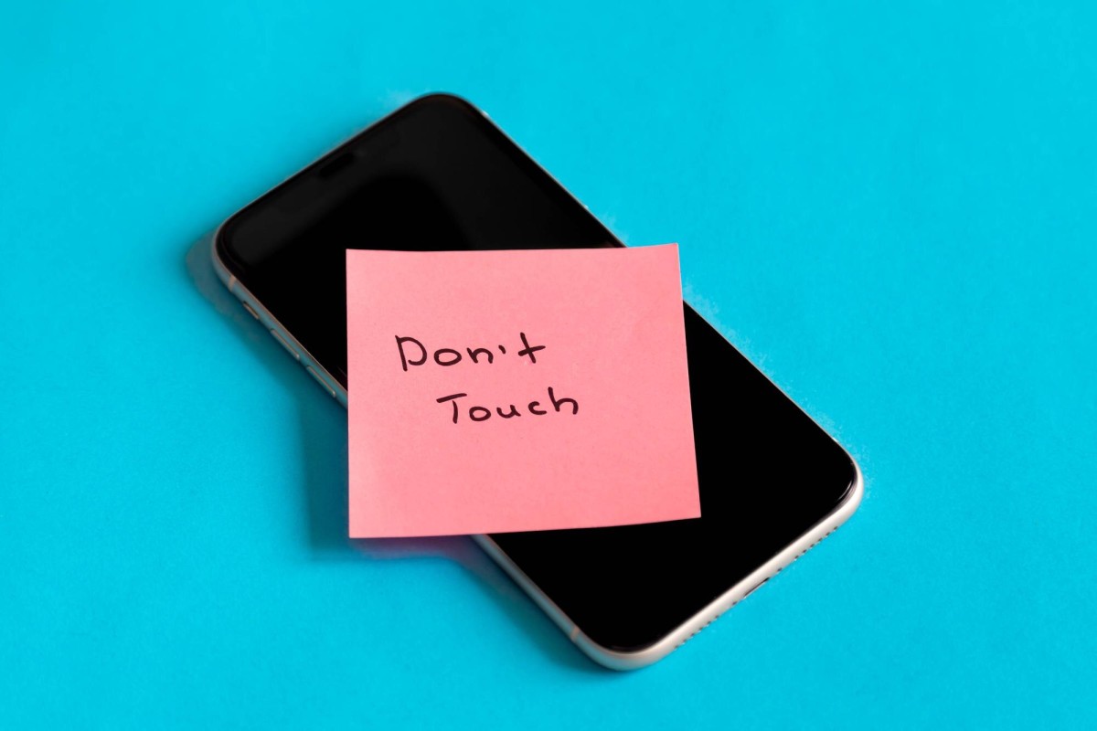 Person using registration form on smartphone