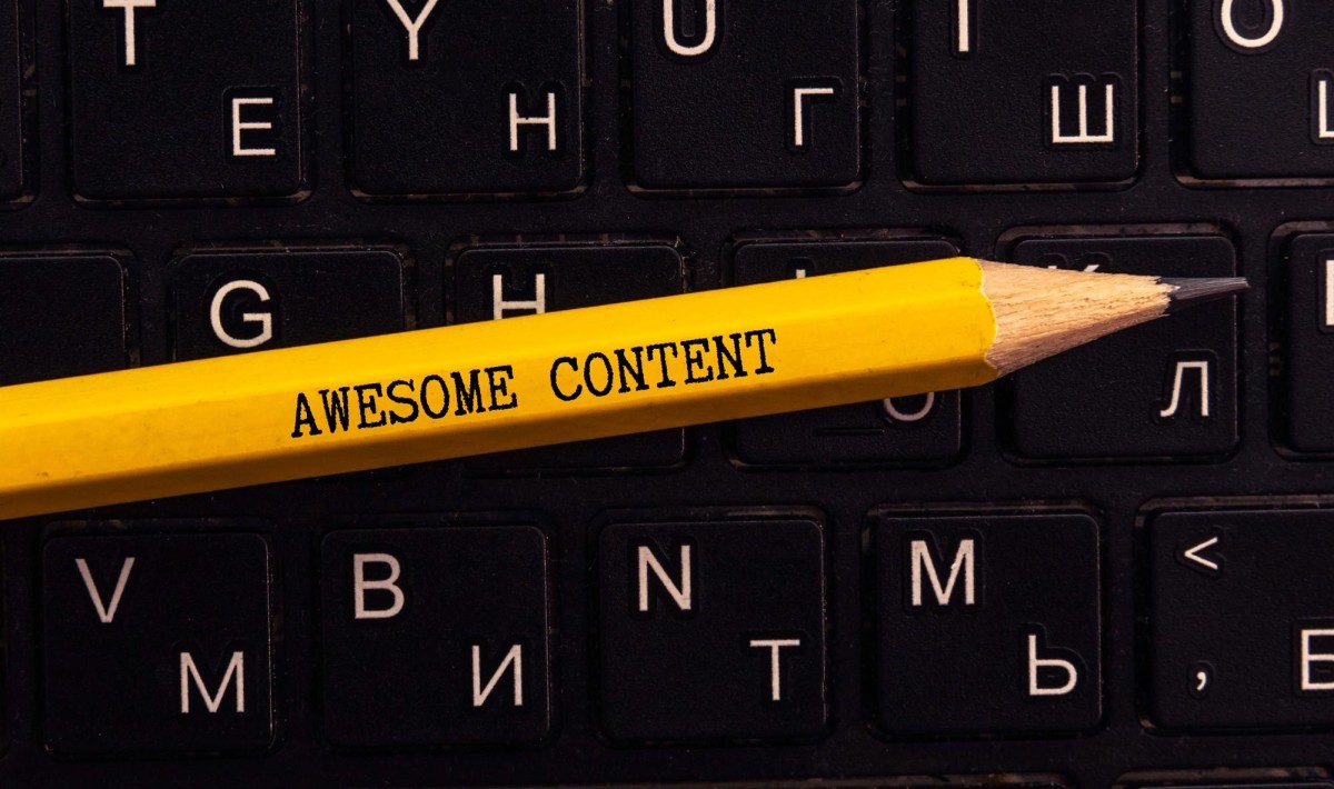 Person writing unique blog content online