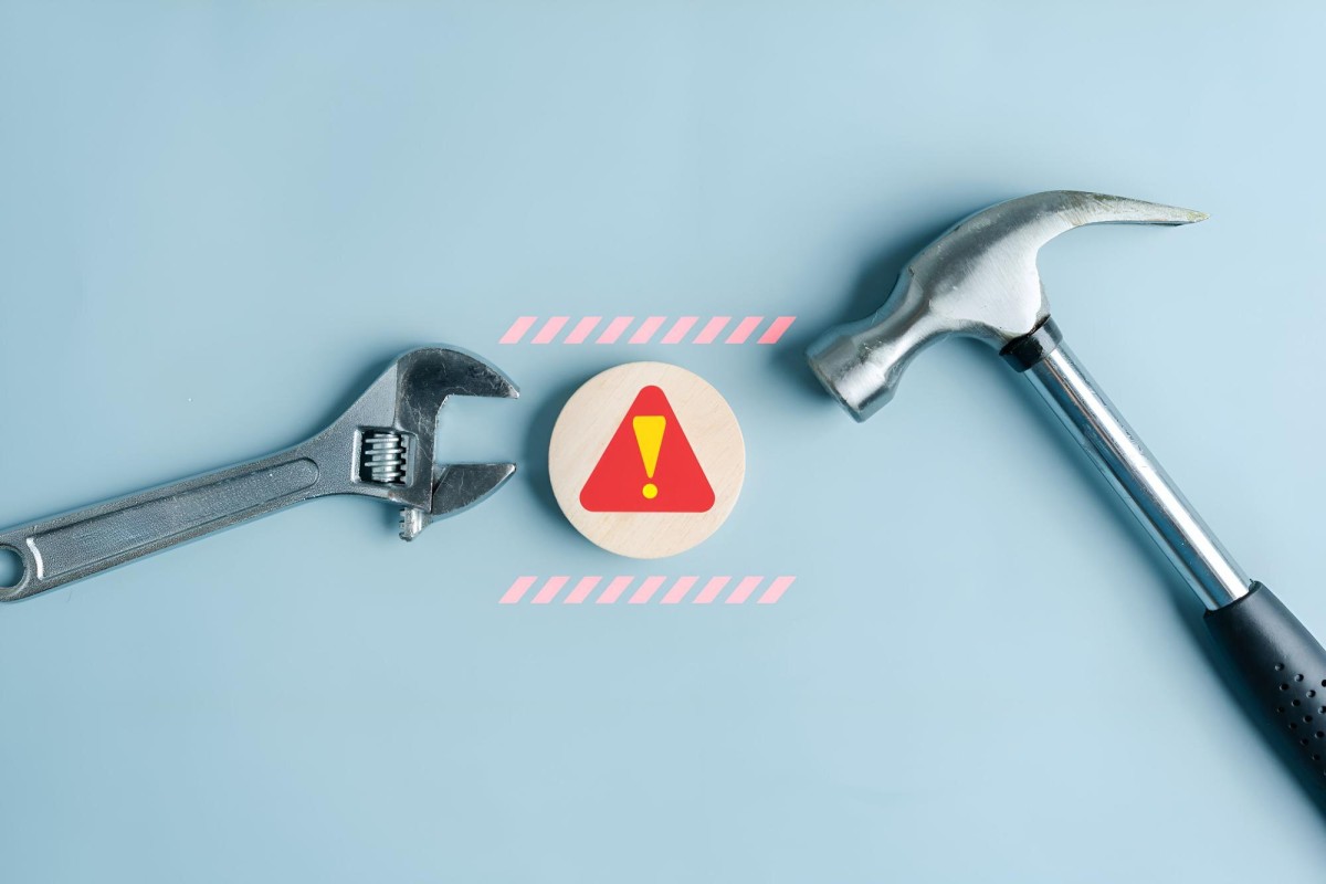 Warning sign with caution symbols and tools